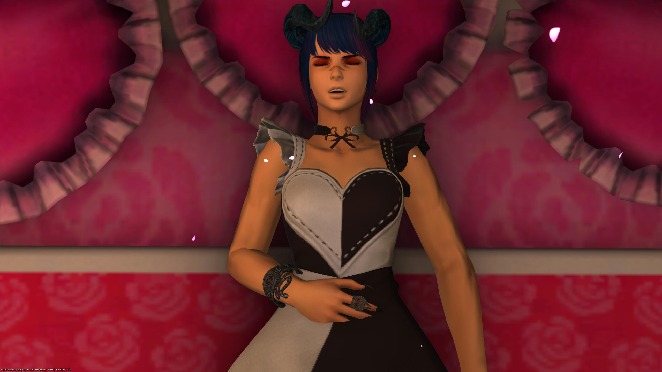 Siyra napping in her Valentine's day bed with her Valentine's Day outfit.